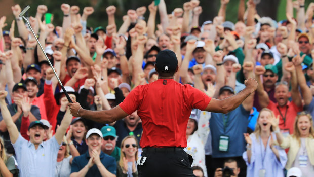Tiger Woods celebrates after sinking his winning putt at Augusta to win the US Masters in April.