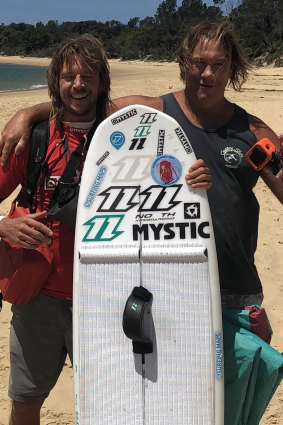 Making friends along the way: Kiss von Soly and Bundeena local Stu Buman on Jibbon Beach on Thursday. 