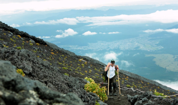 Leigh Conkie climbing Mount Fuji in Japan.