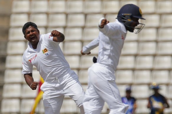 Rangana Herath celebrates one of his 28 wickets in the 2016 series against Australia.