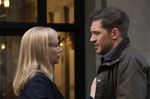 This image released by Sony Pictures shows Michelle Williams, left, and Tom Hardy in a scene from "Venom." (Frank Masi/Sony Pictures via AP)
