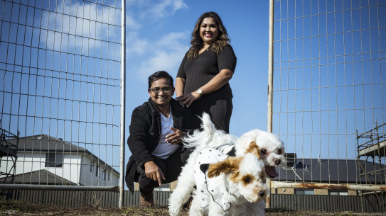 Gelora Alphonse and Sharaniah Thasarathan, with their dogs, Yuki and Yuna, on their block of land in Clyde. 