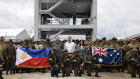 Australian Defence Minister Richard Marles (centre) with Philippine National Defence Secretary Gilberto Teodoro jnr (centre left), Australian ambassador to the Philippines Hae Kyong Yu (centre right), and soldiers before the drills.