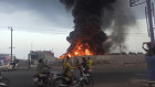 Plumes of smoke rise above a fire after an Israeli strike on Hodeida, Yemen.