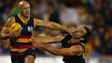 Nigel Smart dishes off a stern ‘don’t argue’ to Bombers great Scott Lucas back in 2003.