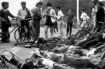 The bodies of dead civilians lie among mangled bicycles near Beijing's Tiananmen Square on June 4.