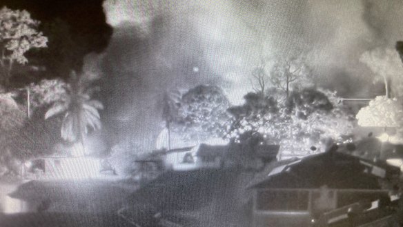 CCTV footage shows smoke from burning homes in Aurukun during unrest on New Year's Day.