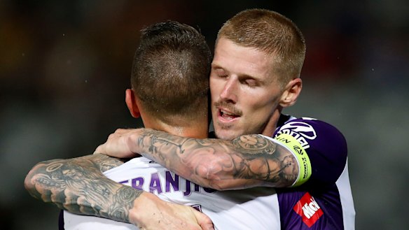 Icing on the cake: Andy Keogh celebrates his late goal with Ivan Franjic.