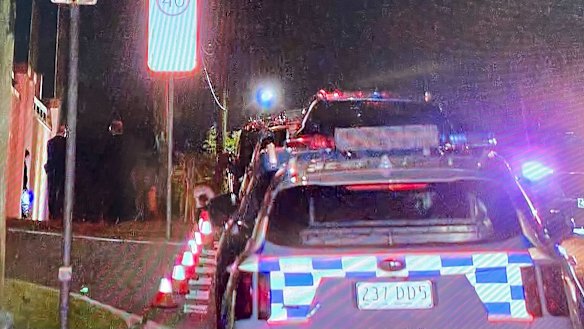 Police vehicles at the house on Thursday night.