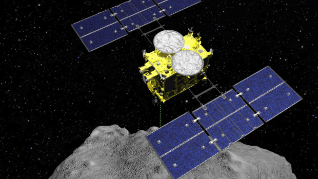 Computer graphics image released by the Japan Aerospace Exploration Agency (JAXA) shows the Hayabusa2 spacecraft above the asteroid Ryugu. 