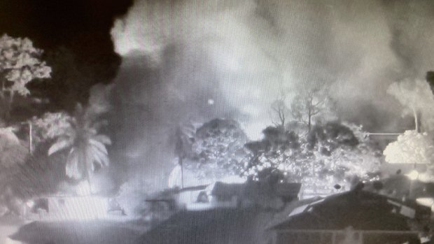 CCTV footage shows the smoke from burning homes in Aurukun during the unrest on New Year's Day.