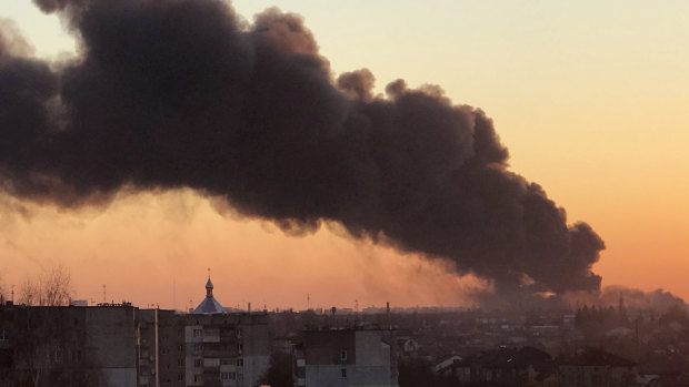 A cloud of smoke raises after an explosion in Lviv, western Ukraine, Friday, March 18, 2022. The mayor of Lviv says missiles struck near the city’s airport early Friday. (AP Photo)