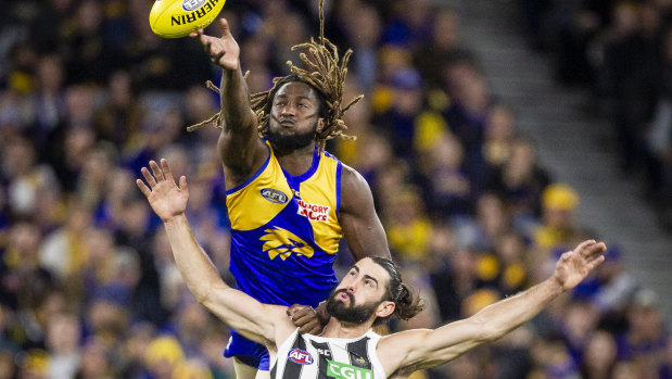 Eagle Nic Naitanui soars over Brodie Grundy at Optus Stadium – but Collingwood became the second team this year to knock off the Eagles at home.