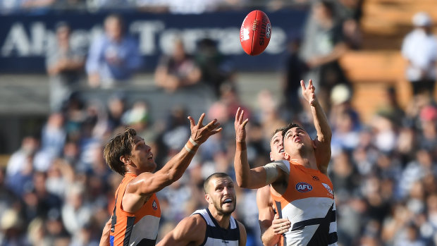 Up for grabs: Tim Taranto (right) and Giants teammate Matt de Boer compete with Sam Menegola and Joel Selwood for the ball.