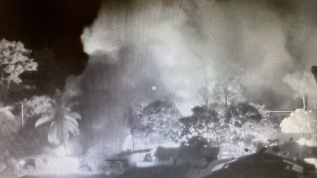 CCTV footage shows the smoke from burning homes in Aurukun during the unrest on New Year's Day.