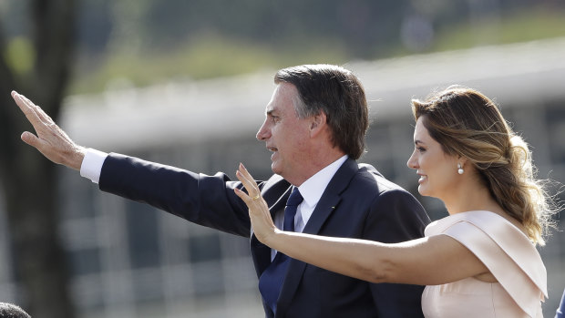 Brazil's new President Jair Bolsonaro, accompanied by his wife Michelle Bolsonaro, at the swearing in ceremony.