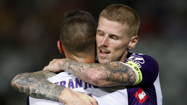 Icing on the cake: Andy Keogh celebrates his late goal with Ivan Franjic.