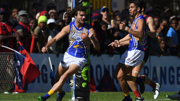 Jack flash: West Coast forward Jack Petruccelle (left) celebrates booting a goal for the Eagles against Melbourne at TIO Traeger Park in Alice Springs.