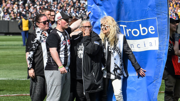Collingwood cheer squad members were gutted after their banner tore apart.