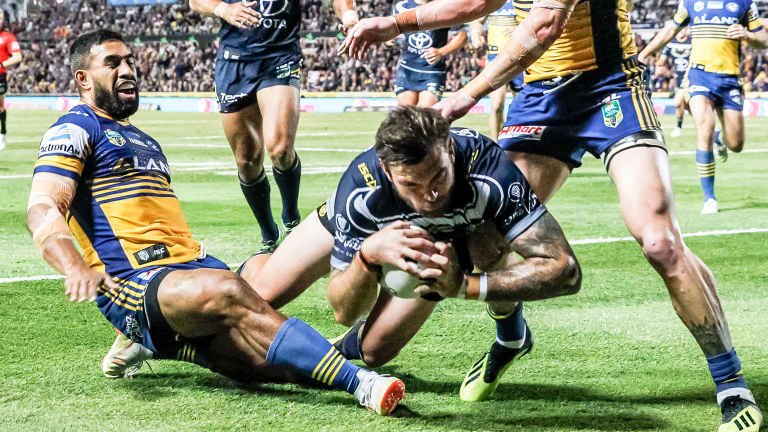 Punctuation point: Kyle Feldt crashes over for the Cowboys as the Eels head towards the spoon.