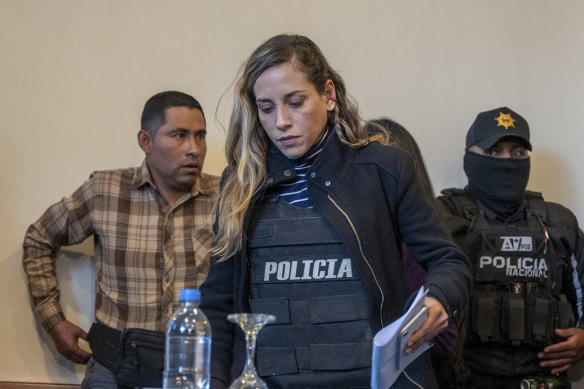 Wearing a bulletproof vest, Andrea Gonzalez, the running mate of slain presidential candidate Fernando Villavicencio, arrives for a press co<em></em>nference in Quito, Ecuador.