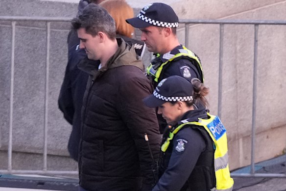 Police take Jacob Hersant away from the Shrine of Remembrance on Friday. He will be charged at a later date.