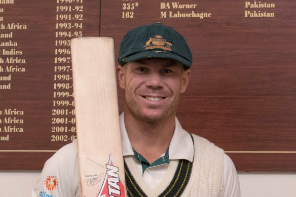David Warner in front of the Adelaide Oval honour board.