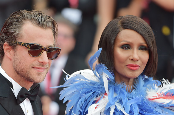Francesco Carrozzini and Iman walk the red carpet before the opening ceremony of the 76th Venice Film Festival.