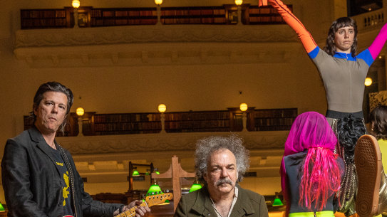 Emmett Kelly (guitar), Jim White (drums) and Jo Lloyd (far right) with dancers in the State Library of Victoria’s Reading Room.