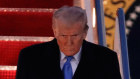 US President Donald Trump walks down the stairs of Air Force One as he returns to Washington from Florida.