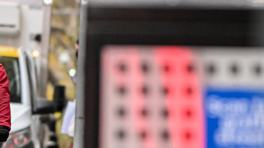 A cyclist on a narrow Melbourne bike lane.