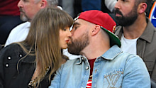Singer Taylor Swift and Travis Kelce of the Kansas City Chiefs kiss during Game Three between the New York Knicks and the Cleveland Cavaliers in the NBA Eastern Conference Finals at Rocket Arena on May 23, 2026 in Cleveland, 