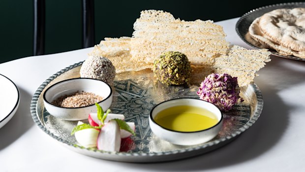 Lamb naye balls coated with sesame seeds, crushed pistachio and dried rose petals.