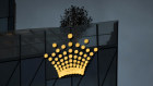  The Crown Resorts Ltd. logo atop the Crown Sydney hotel resort and the One Barangaroo Crown residences in Sydney, Australia, on Tuesday, Feb. 16, 2021. The crisis enveloping Crown deepened after a state regulator recommended an inquiry into the company’s fitness to run its Perth casino hours after the company was formally found unsuitable to operate a Sydney casino. Photographer: Brent Lewin/Bloomberg