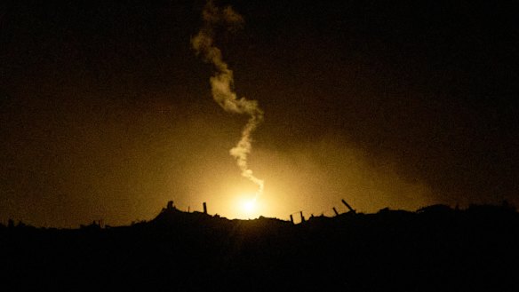 An Israeli army flare drifts over an area in the northern Gaza Strip on Tuesday.