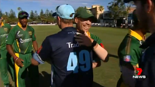 Smiling again: The former Test teammates acknowledge each other at the end of the match.