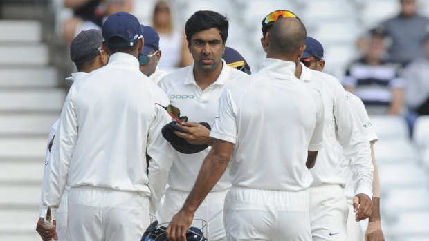 All out: India's Ravichandran Ashwin, center, is congratulated by teammates after the dismissal of James Anderson, England's last wicket, during the fifth day in Nottingham.