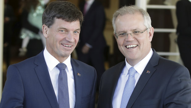 Angus Taylor and Scott Morrison after the new federal cabinet was sworn in at Parliament House on  Tuesday.