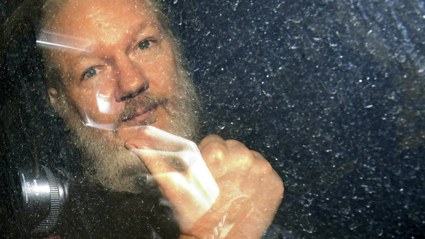 Julian Assange is driven away from the Ecuadorian embassy in London after his arrest.