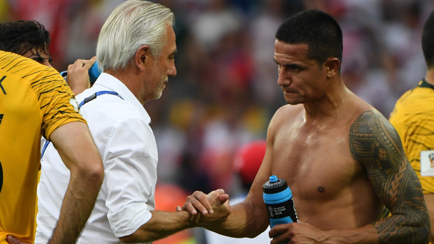 End of a (very short) era: Bert van Marwijk shakes hands with Tim Cahill.