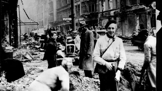 Germans civilians clean up widespread damage to Berlin in 1945. 