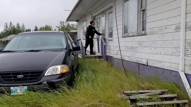 RCMP officers search homes and buildings in the Gillam, Manitoba area, as they continue to hunt for two teenagers being sought in the killings of three people in northern British Columbia. 