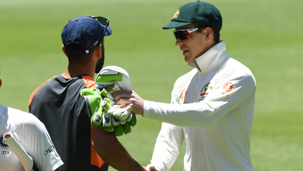 Polite: After their earlier clashes, Tim Paine and Virat Kohli shake hands.