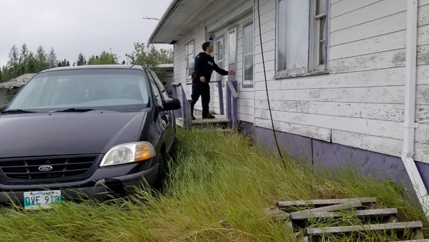 RCMP officers search homes and buildings in the Gillam, Manitoba area, as they continue to hunt for two teenagers being sought in the killings of three people in northern British Columbia. 