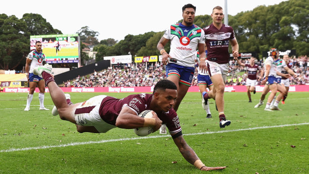 Jason Saab scores one of his three tries against the Warriors on Sunday.