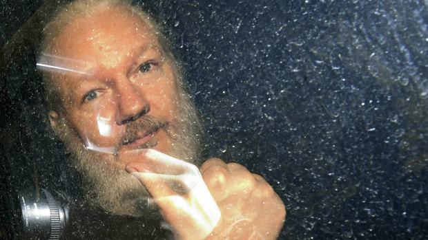 Julian Assange is driven from the Ecuadorian embassy in London after his arrest in April 2019.