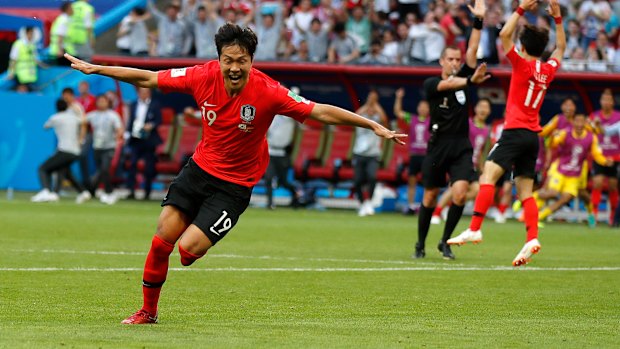 Stunning upset: Kim Young-gwon celebrates after scoring the first goal of the match. 