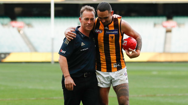 Alastair Clarkson and Shaun Burgoyne leave the MCG for the final time in Hawks colours.