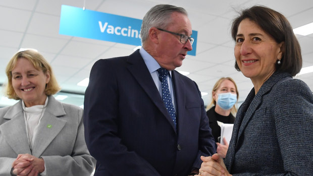 NSW Premier Gladys Berejiklian (right) and Health Minister Brad Hazzard at the mass vaccination centre at Sydney Olympic Park on Monday.