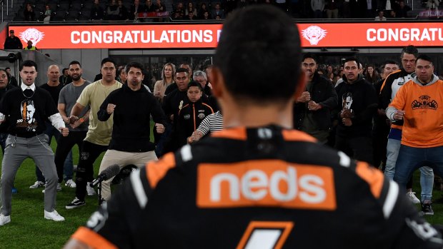 Another milestone: Benji Marshall watches friends and family perform a haka after his 300th NRL match in July.